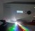The SuperK Extreme supercontinuum “white-light” laser source, commercially available from consortium member NKT Photonics. Wen dispersing its broadband laser light on a prism a rainbow of colours appear.